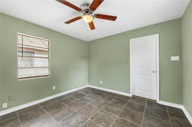 spare room with ceiling fan