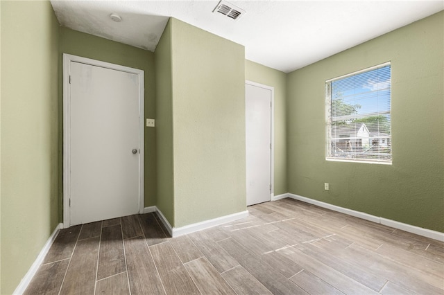 interior space with light hardwood / wood-style floors and a closet