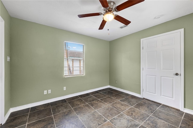 spare room with ceiling fan