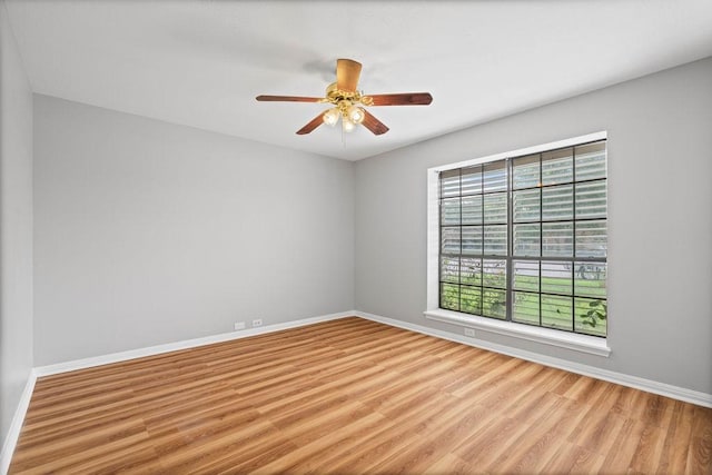 2441 Windsong Dr, Corpus Christi, TX 78414 - unfurnished room featuring wood finished floors, baseboards, and a ceiling fan