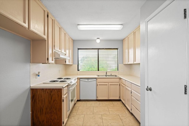 2441 Windsong Dr, Corpus Christi, TX 78414 - kitchen featuring white appliances, under cabinet range hood, a sink, light countertops, and light tile patterned floors