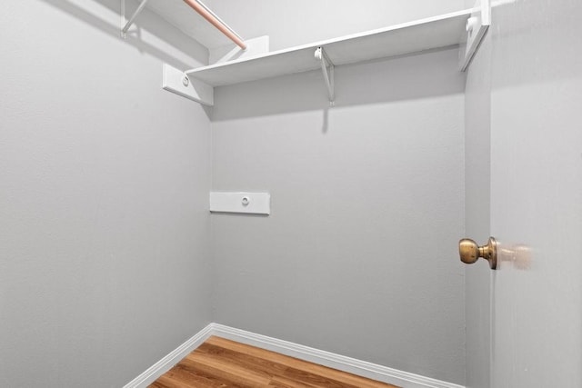 2441 Windsong Dr, Corpus Christi, TX 78414 - walk in closet featuring wood finished floors