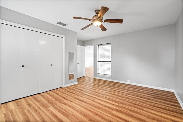 2441 Windsong Dr, Corpus Christi, TX 78414 - unfurnished bedroom featuring light wood-style floors, baseboards, a closet, and a ceiling fan