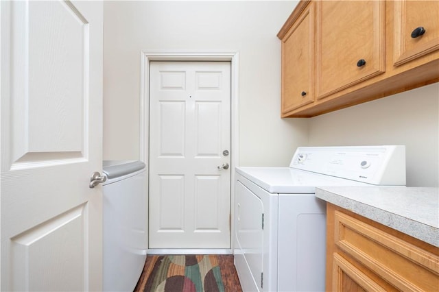 washroom with cabinets and separate washer and dryer