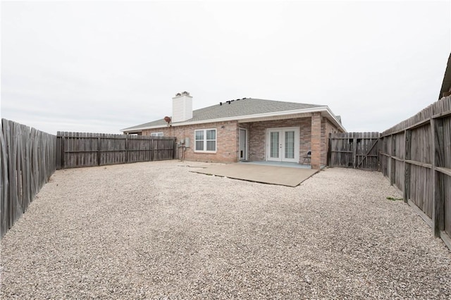 back of property featuring a patio and french doors