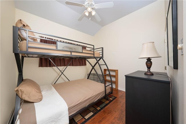 bedroom with lofted ceiling, ceiling fan, and dark hardwood / wood-style floors