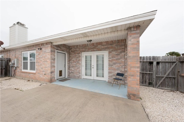 back of house with a patio area and french doors