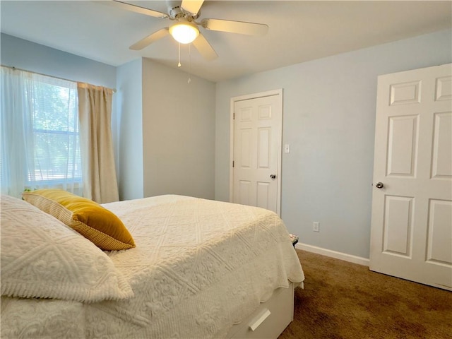 carpeted bedroom featuring ceiling fan