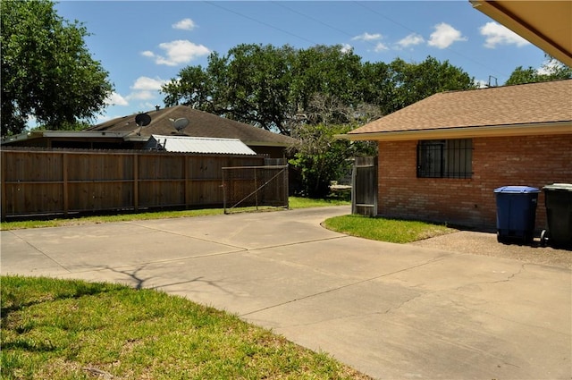 view of patio featuring fence