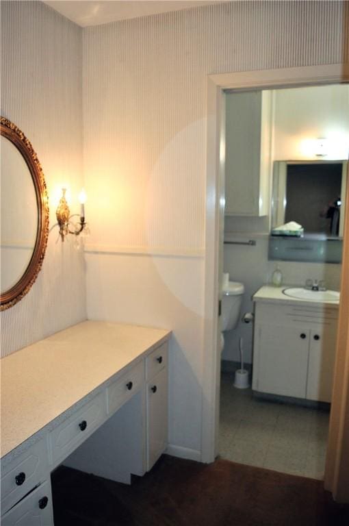 bathroom featuring vanity, toilet, and tile patterned floors