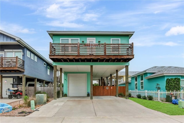 view of front facade with a balcony and a carport