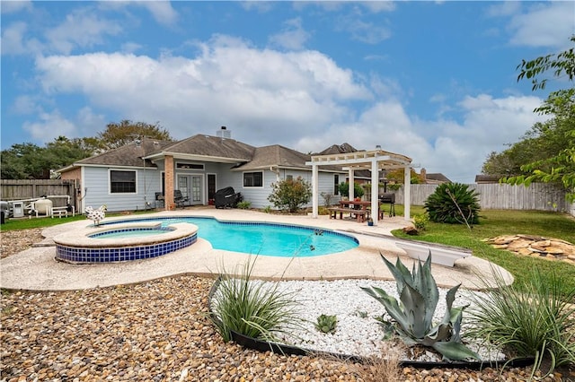 705 Aurora St, Bishop, TX 78343 - view of swimming pool featuring a pergola, a patio area, fence, and a pool with connected hot tub