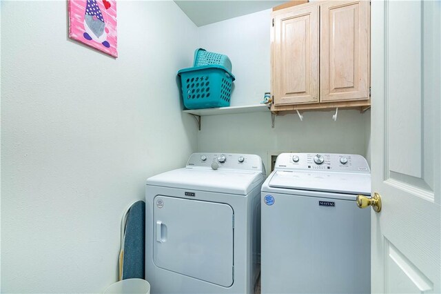 705 Aurora St, Bishop, TX 78343 - clothes washing area with washer and dryer and cabinet space