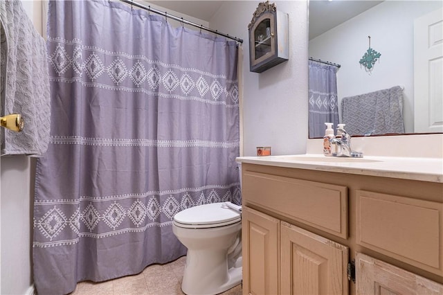 705 Aurora St, Bishop, TX 78343 - bathroom featuring toilet, vanity, tile patterned flooring, and curtained shower