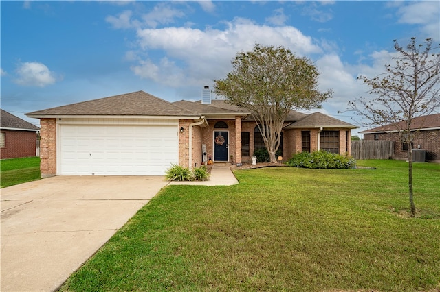 ranch-style house featuring a garage, cooling unit, and a front yard