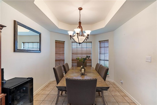 705 Aurora St, Bishop, TX 78343 - dining room with light tile patterned floors, a chandelier, baseboards, and beverage cooler