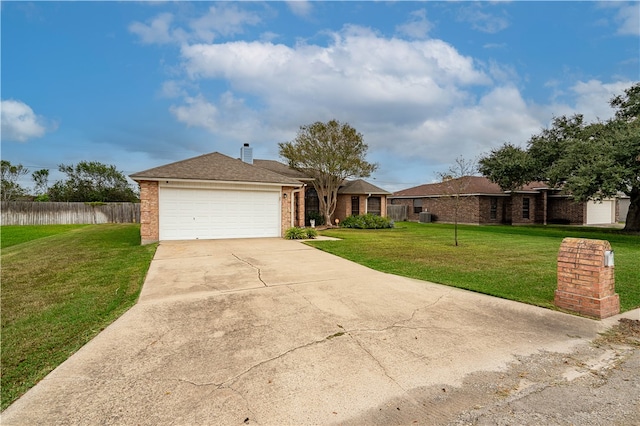 ranch-style house with a garage and a front yard