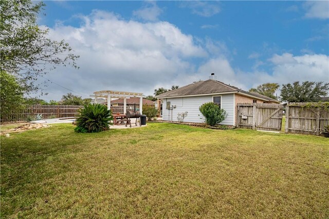 705 Aurora St, Bishop, TX 78343 - view of yard featuring a pergola, a patio, and a gate