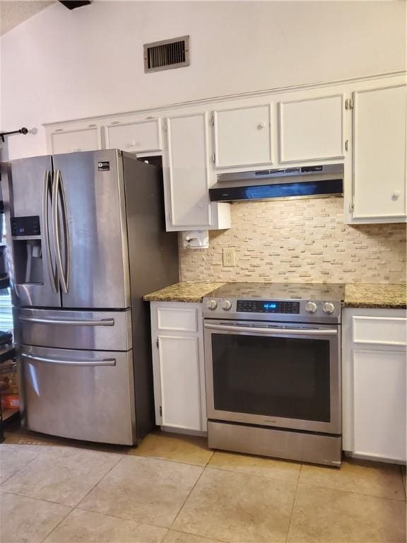 kitchen featuring white cabinetry, appliances with stainless steel finishes, backsplash, and stone counters