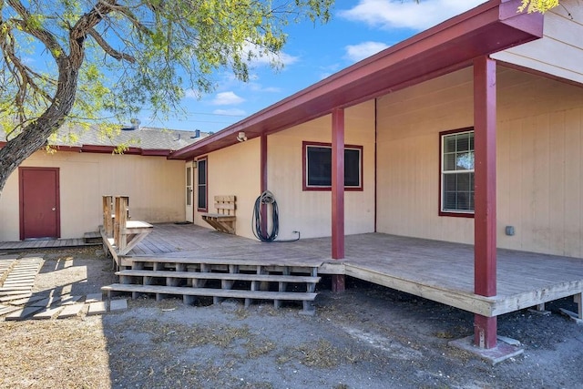 back of house with a wooden deck