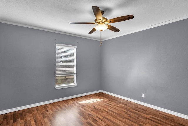 empty room with hardwood / wood-style floors, ceiling fan, crown molding, and a textured ceiling