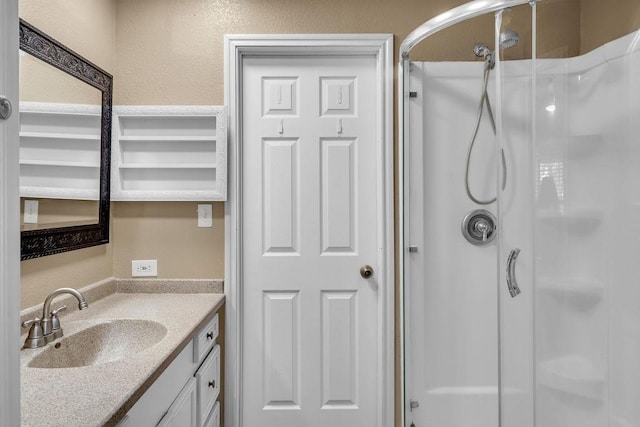 bathroom with vanity and walk in shower