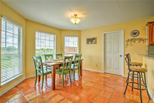 9386 Private Rd Unit 2155, Sinton, TX 78387 - dining space featuring baseboards and light tile patterned flooring