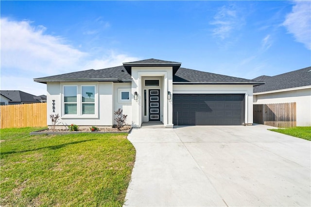 7721 Keiras Way, Corpus Christi, TX 78414 - prairie-style house featuring an attached garage, concrete driveway, roof with shingles, and stucco siding