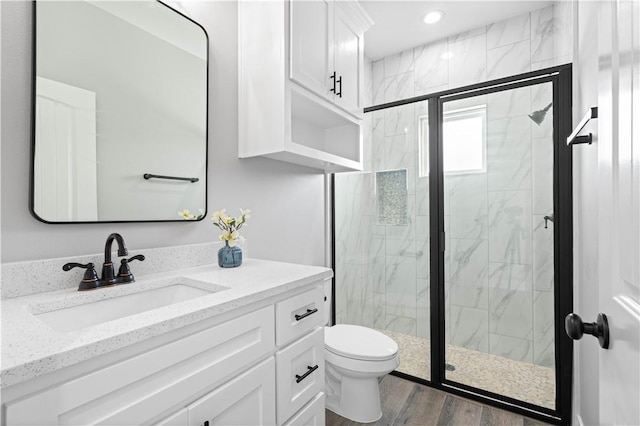 7721 Keiras Way, Corpus Christi, TX 78414 - full bath featuring vanity, a marble finish shower, toilet, wood finished floors, and recessed lighting