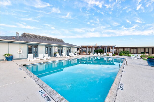 view of swimming pool featuring a patio