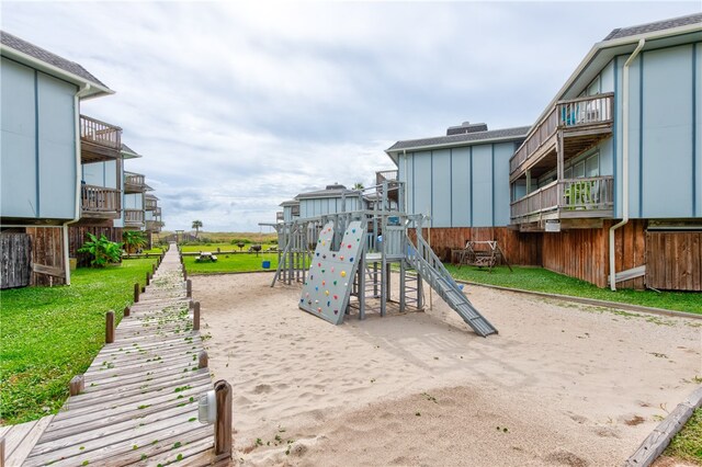 view of playground with a yard