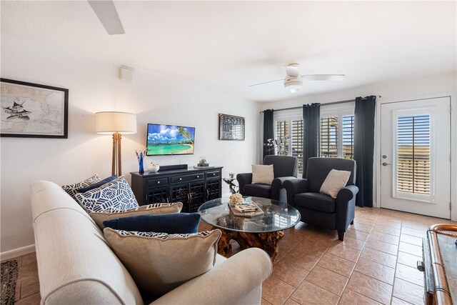 living room with light tile patterned flooring and ceiling fan