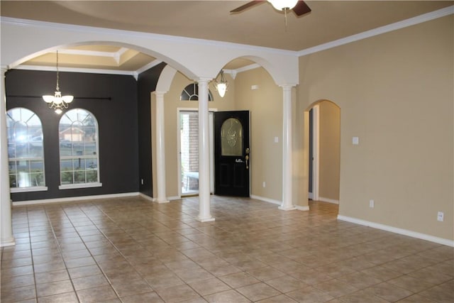 tiled entryway with decorative columns, a raised ceiling, ceiling fan with notable chandelier, and ornamental molding