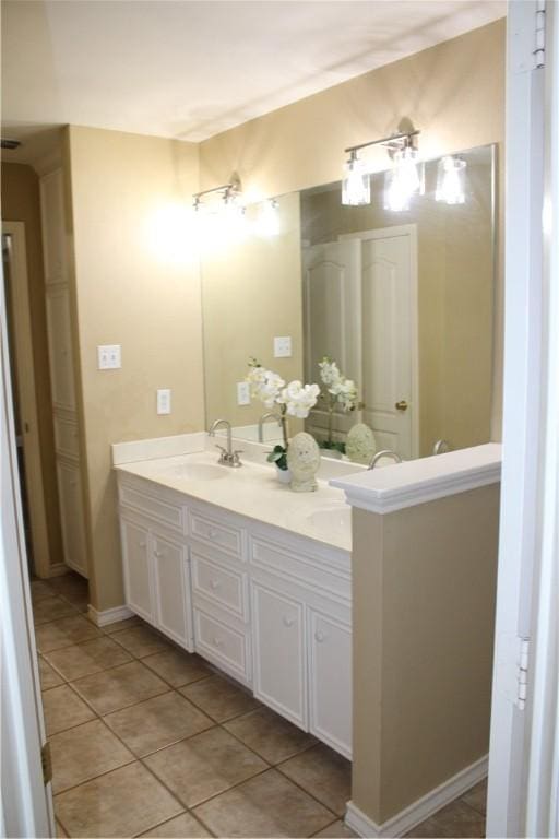 bathroom with tile patterned flooring and vanity