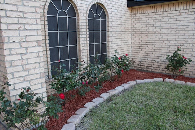 doorway to property featuring a lawn