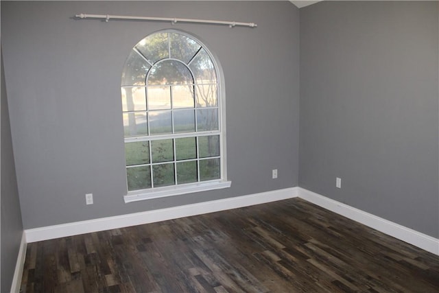 unfurnished room featuring dark hardwood / wood-style floors