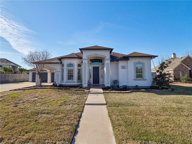 view of front facade featuring a garage and a front yard