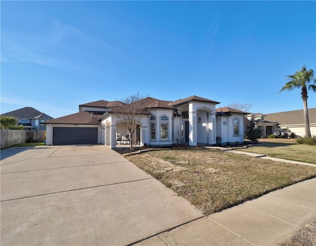 view of front facade featuring a garage and a front lawn