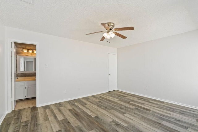 1134 Harbor Village Dr, Corpus Christi, TX 78412 - spare room featuring ceiling fan, wood finished floors, a textured ceiling, and baseboards