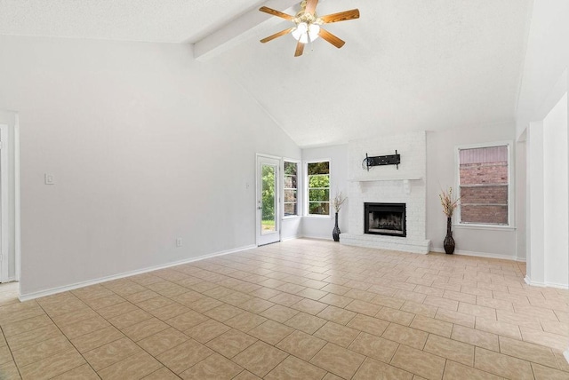 1134 Harbor Village Dr, Corpus Christi, TX 78412 - unfurnished living room featuring beamed ceiling, a ceiling fan, a fireplace, high vaulted ceiling, and baseboards