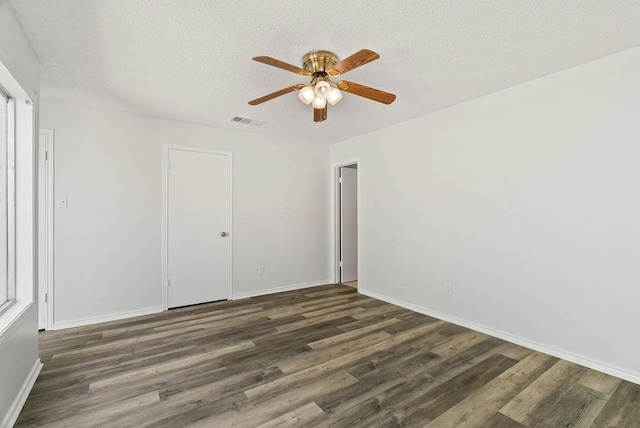 1134 Harbor Village Dr, Corpus Christi, TX 78412 - spare room featuring wood finished floors, a ceiling fan, baseboards, and a textured ceiling