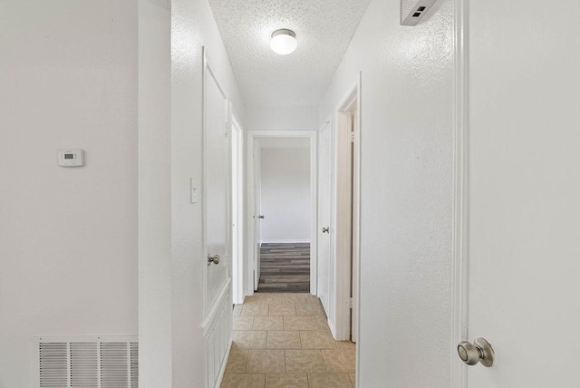 1134 Harbor Village Dr, Corpus Christi, TX 78412 - hallway with a textured ceiling and light tile patterned floors