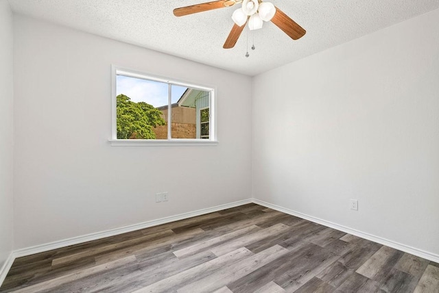 1134 Harbor Village Dr, Corpus Christi, TX 78412 - unfurnished room featuring dark wood-style flooring, ceiling fan, a textured ceiling, and baseboards