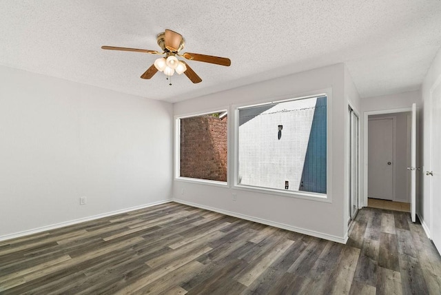 1134 Harbor Village Dr, Corpus Christi, TX 78412 - empty room with dark wood-style floors, a textured ceiling, a ceiling fan, and baseboards
