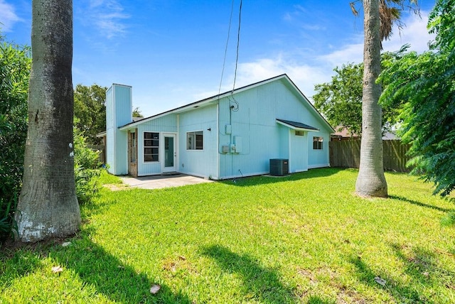 1134 Harbor Village Dr, Corpus Christi, TX 78412 - back of house with central AC unit, a chimney, and a patio