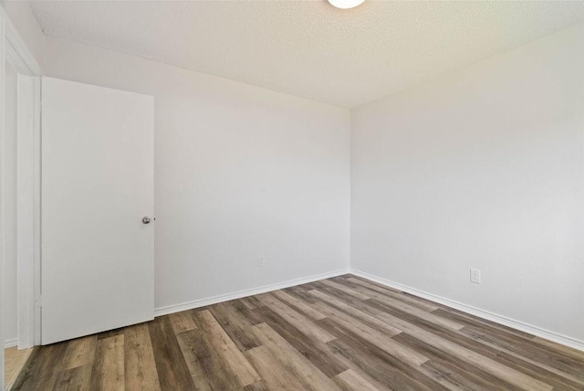 1134 Harbor Village Dr, Corpus Christi, TX 78412 - unfurnished room featuring wood finished floors, baseboards, and a textured ceiling