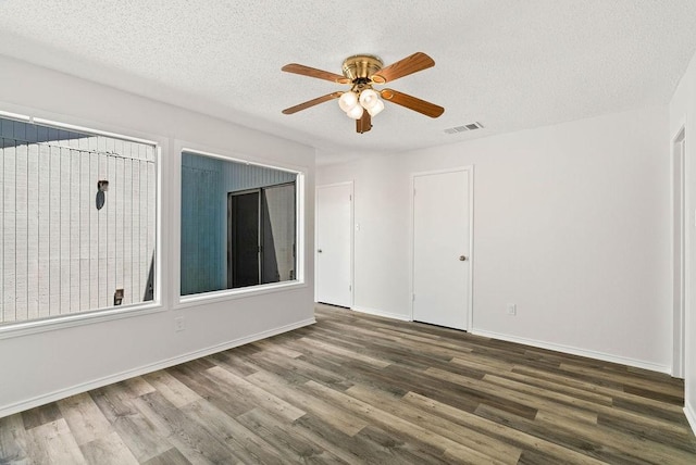 1134 Harbor Village Dr, Corpus Christi, TX 78412 - spare room featuring wood finished floors, a textured ceiling, a ceiling fan, and baseboards