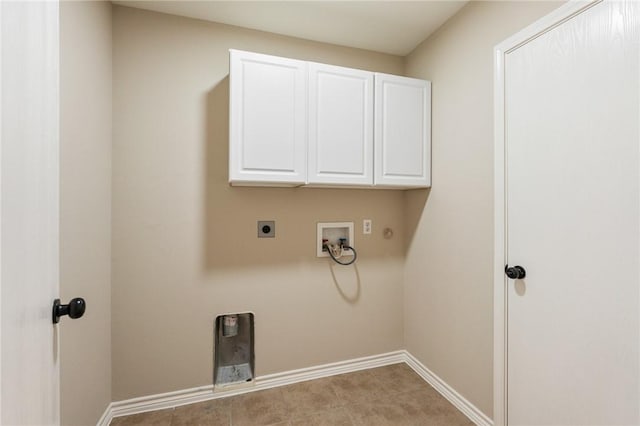 washroom with hookup for a washing machine, cabinet space, baseboards, and hookup for an electric dryer