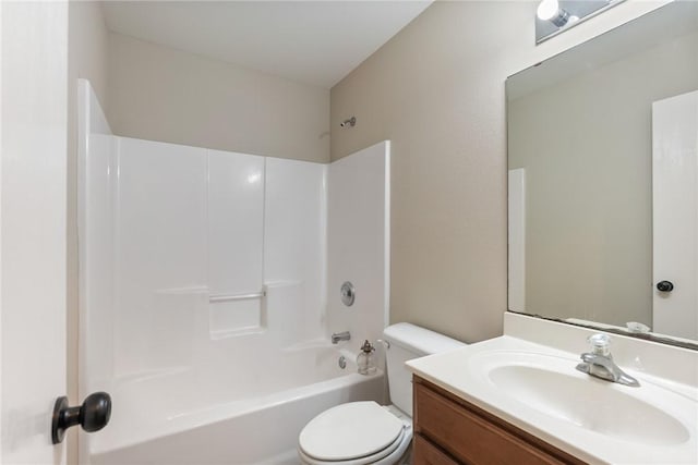 bathroom with toilet, tub / shower combination, and vanity