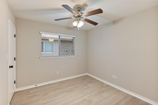 unfurnished room featuring a ceiling fan, light wood-style flooring, and baseboards